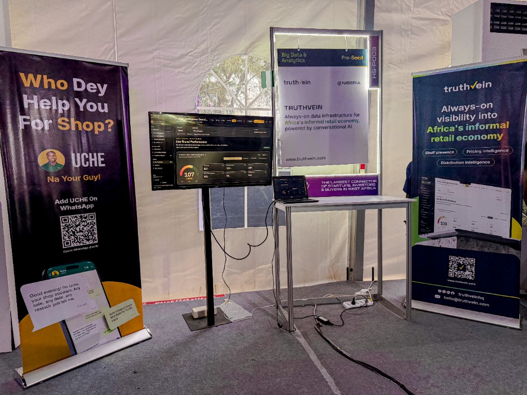 The TruthVein stand with the UCHE banner and the live dashboard